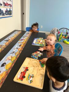 young children learning at table