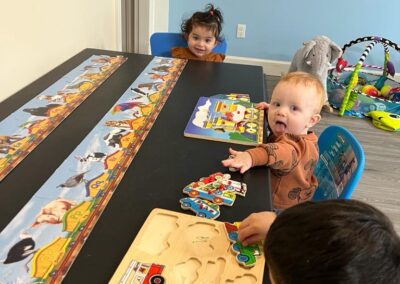 young children learning at table