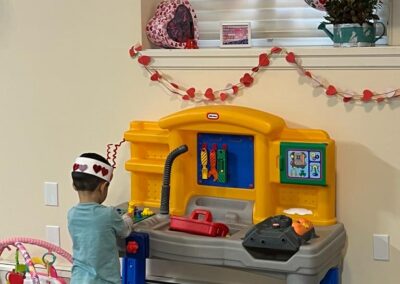 kid playing at toy bench