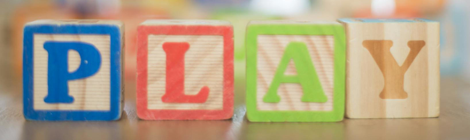 Wood blocks spelling out PLAY